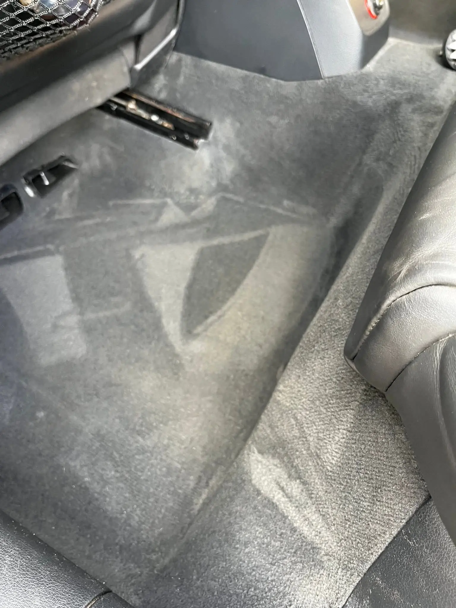 Car interior footwell carpet cleaned by Craggs cleaning services